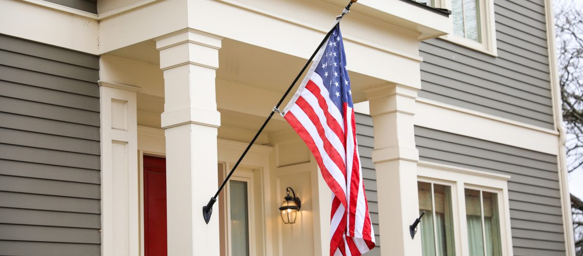 US flag depicting historic freedom and american pride along with independence of fourth of july and patriotism on a national level in the sky and home